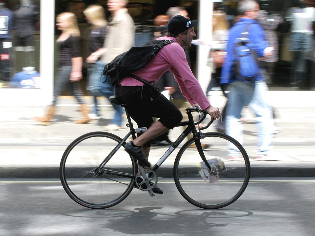 Bicycle_courier_on_Oxford_Street,_London